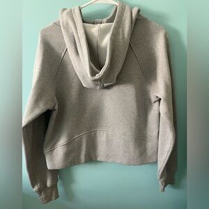 A grey quarter zip sweatshirt with a pocket, never worn